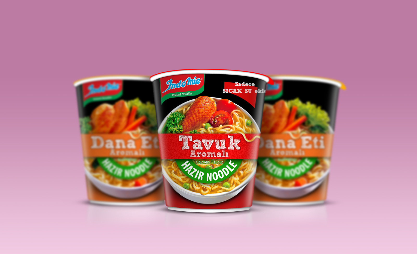 Three Indomie cups on pink