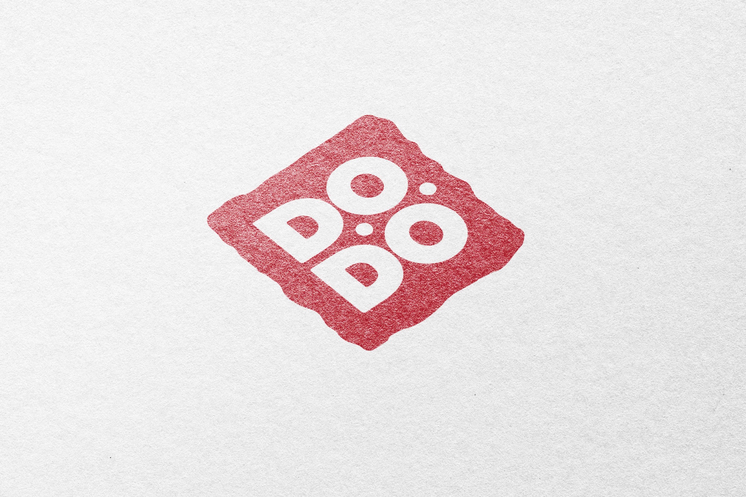 The Dodoner badge stamped on paper